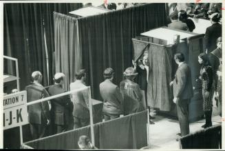 Leaving voting machine yesterday at Conservative leadership convention, woman delegate draws back curtain