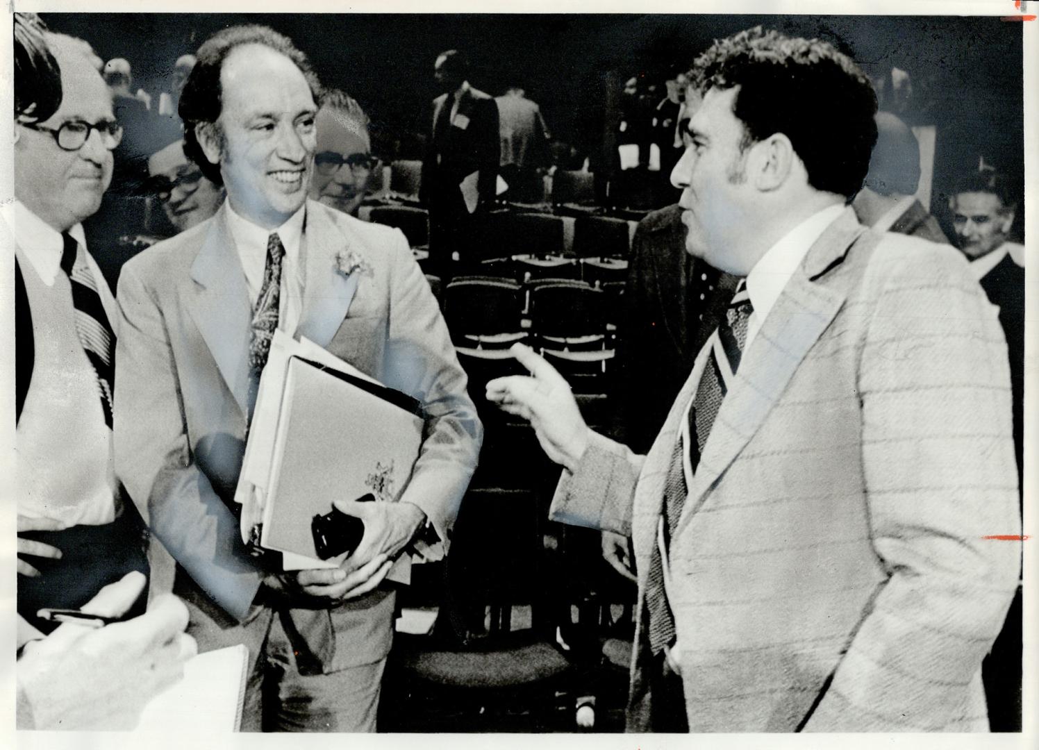 B.C. Premier David Barrett (right) and Prime Minister Pierre Trudeau exchange friendly goodbys yesterday at the close of the three-day conference in C(...)