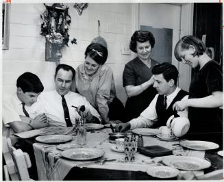 Thanks to Mrs. Armstrong's ingenuity and careful shopping, the family has good, varied meals. From the left are Michael, Mr. Armstrong, Rosalind, Mrs.(...)