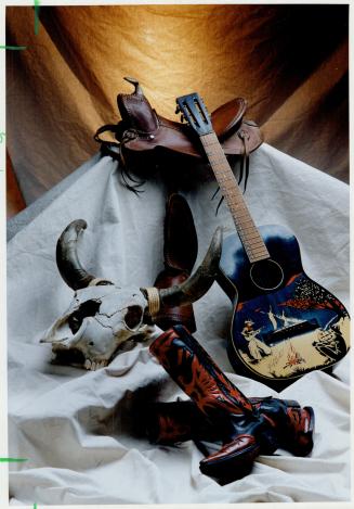 Cowboys and guitars are a natural combination because, well, the cows like music, too