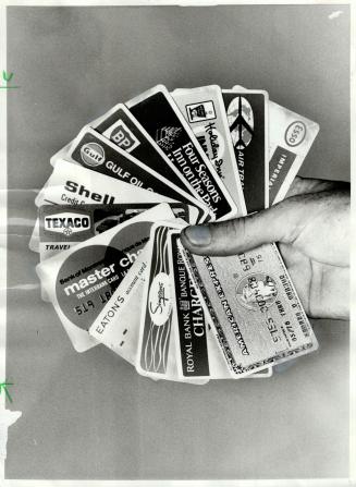 More than credit: Even the big department stores plan to offer automated teller machines for shoppers who wish to withdraw cash from financial institution accounts