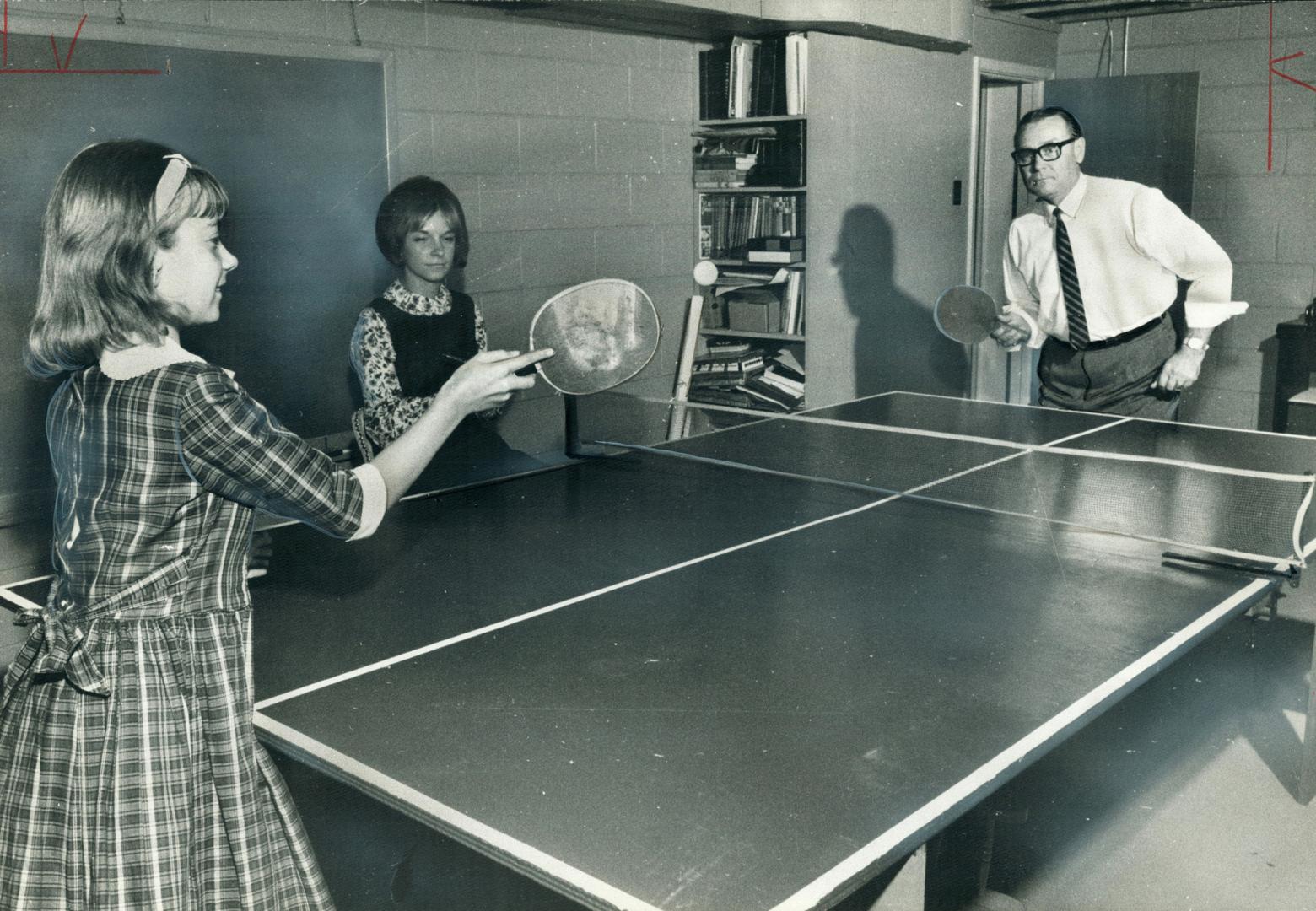 Friendly family battle across the ping-pong table is going on between Peter Teresko and his daughter Valerie 11