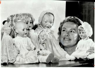 Some of her prized dolls surround Joyce Jones of Etobicoke, newly elected president of the Trillium Doll Society's west chapter. From the left is an A(...)
