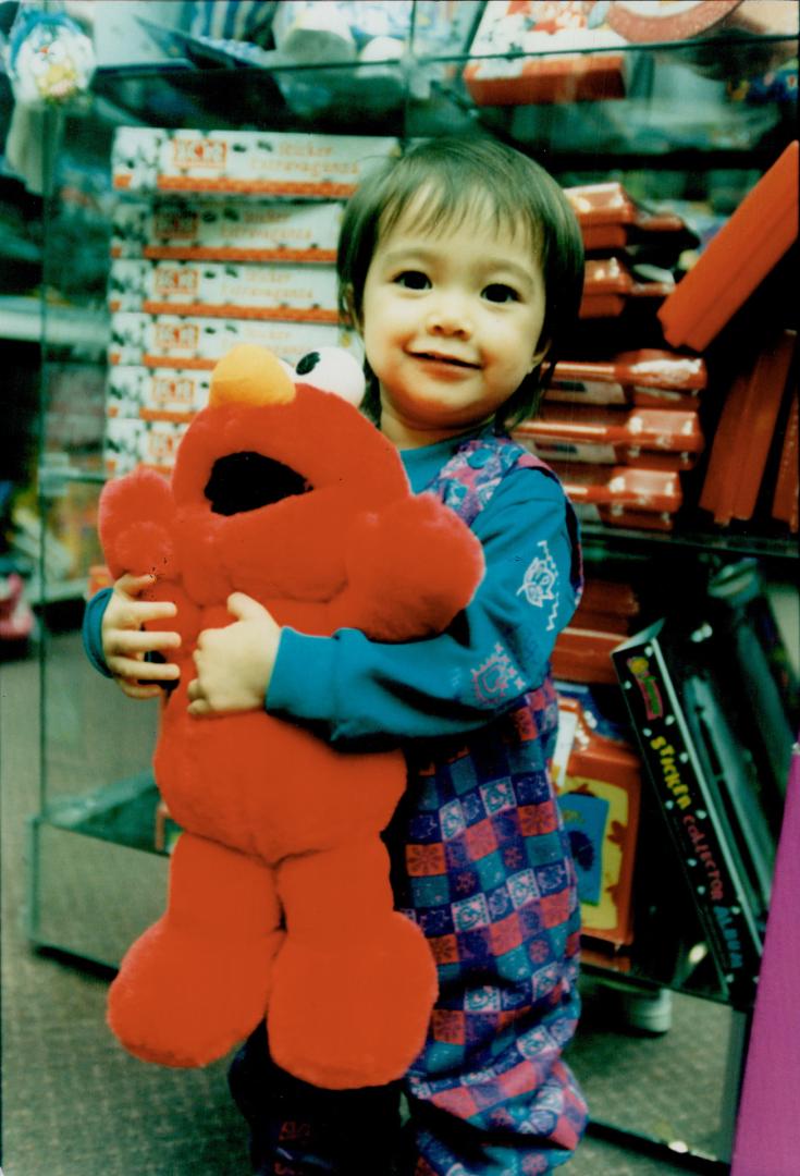 Nakita Byrne with Tickle Me Elmo doll