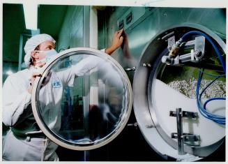 Below, Romain Pluta checks a machine that coats pills, making them easier to swallow