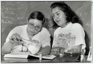 Litmus test: Deborah Baran, left, and Fariba Chelehmal work on their chemistry at Britannia Adult Education Centre, former vocational school now used by adult day students