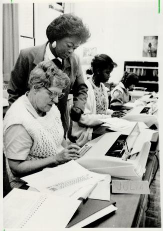 An alternative: Yvonne Nelson gives Julia Bangay some tips in a secretarial class at the Scarborough Centre for Alternative Studies