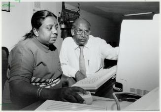 New skills: Murugesapillai Sam Duraiswamy, chairman of the Tamil Eelam society's education committee, with instructor Indra Sivasegharan at computer keyboard