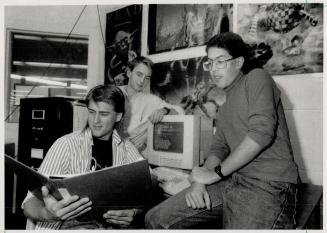 Hellow World: Humber Secondary School students Eli Schuster, seated, Gary Penzier, left, and Mark Attridge can communicate with students in Europe via computer and satellite