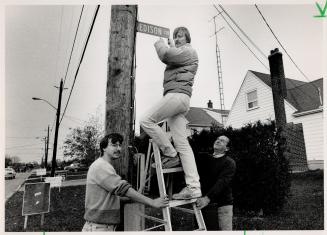 Not on list: The Braini family of Edison Circle, North York, David, left, Joe on ladder, and father Guido, check out the sign on street the enumerators missed