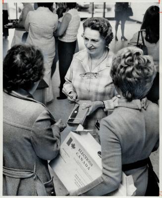 Making sure the machinery of voting runs smoothly, York-Scarborough returning officer Rosemary Clark talks with enumerators. Mrs. Clark is in charge o(...)