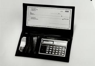 Wallet with cheque book, calculator and credit card space is $19