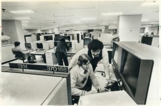 Steve Jeffrey and Peter Boiuklinsky at work in IBM's Don Mills computing centre