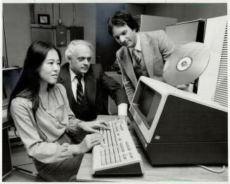 Videodisc: Evannah Sakamoto, Graham Scott and Bill Olivier (standing) of the Ontario Institute of Education demonstrate how a computer-linked videodisc could be an invaluable aid in education
