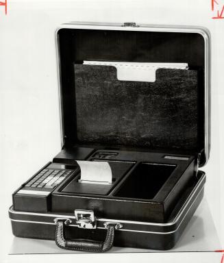 Portable computer: One handy piece of hardware in the arsenal of the electronic revolution is this briefcase, carried by Joe Brown, central regional manager of Norand Corp