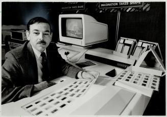 Advanced equipment: Durham College instructor Hugh Charlebois has undreds of slides, created from the Imaginator, an advanced computer graphics system