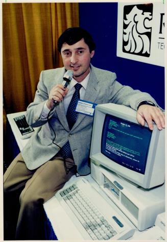 Now hear this: Leo Halpern of Roar Technology gives orders to his computer using the VoiceKey system, demonstrated at the International Centre show