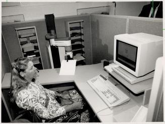 Commanding voice: Quadriplegic Judy Kramer tries out a Heath Zenith computer equipped with a special chip that translates voice commands into signals the machine reads as though they were keystrokes