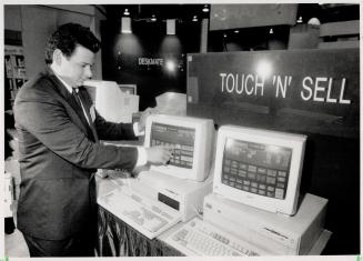 Touching display: William Metalio shows off a cash register or computer that uses a touchscreen