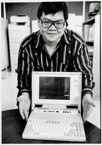 In the lab: Teacher Robert Lau tested the new IBM laptop and found it was a winner in many comparisons with bigger desk top machines