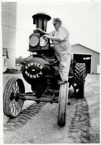 Still running: Wilfrid Leslie to Halton Hills gets his 1919 traction steam engine ready for the Steam Era Show in Milton this weekend