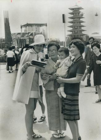 A familiary sight on the grounds of Expo 70 Oska, Japan, is a grandmother dressed in traditional kimono with daughter ad gradcild dressed in Western c(...)