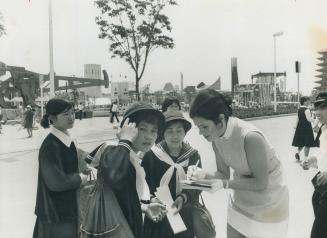 Signing autographs at Expo 70 in Osaka, Japan, is one of the major tasks of Cathy Fauquier, 25, of Toronto, one of the hostesses at the Ontario pavili(...)