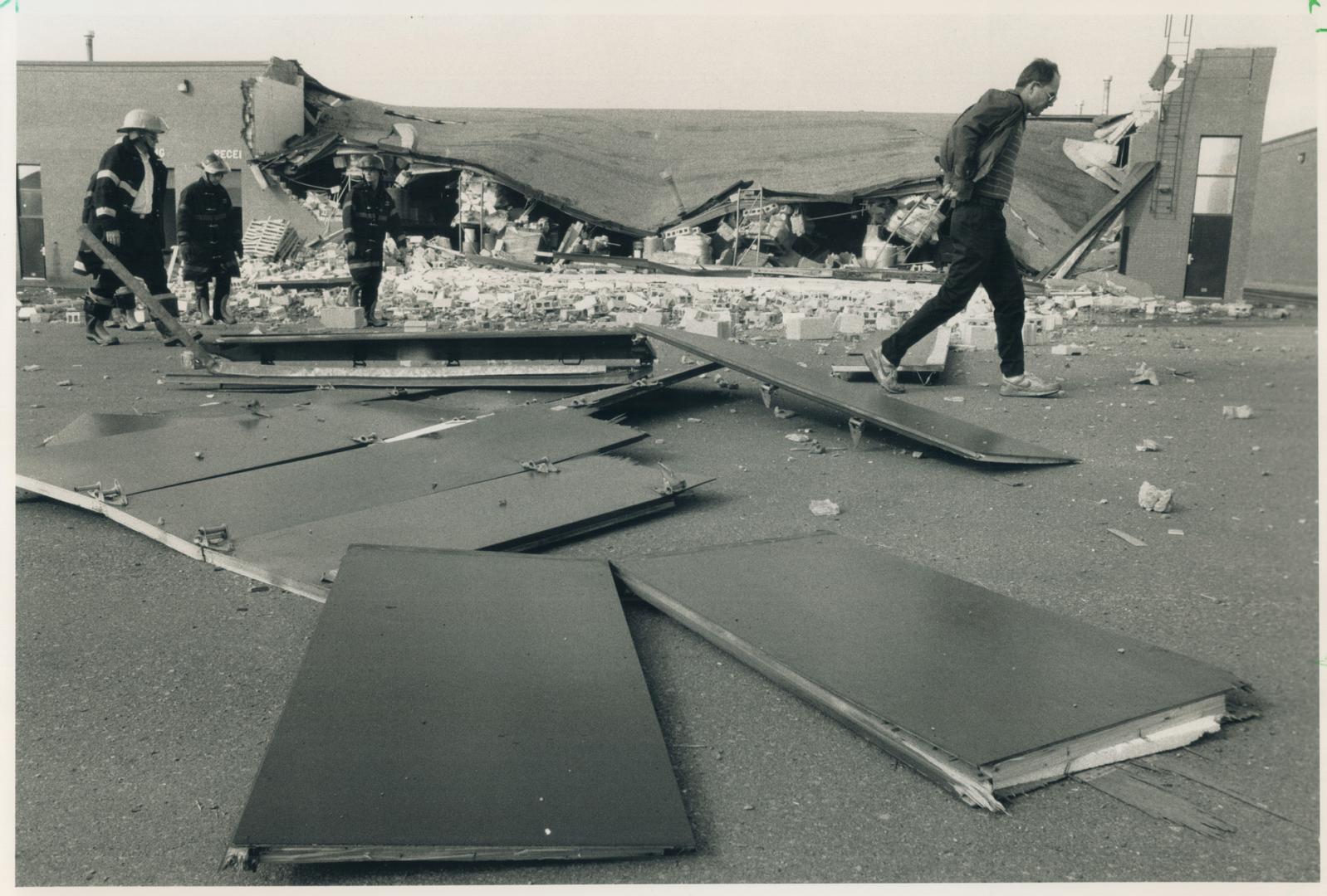 Building owner Jerry Steinbok (right) looks over what's left after an explosion today gutted a chemical plant and forced the evaculation of Pine Tree (...)