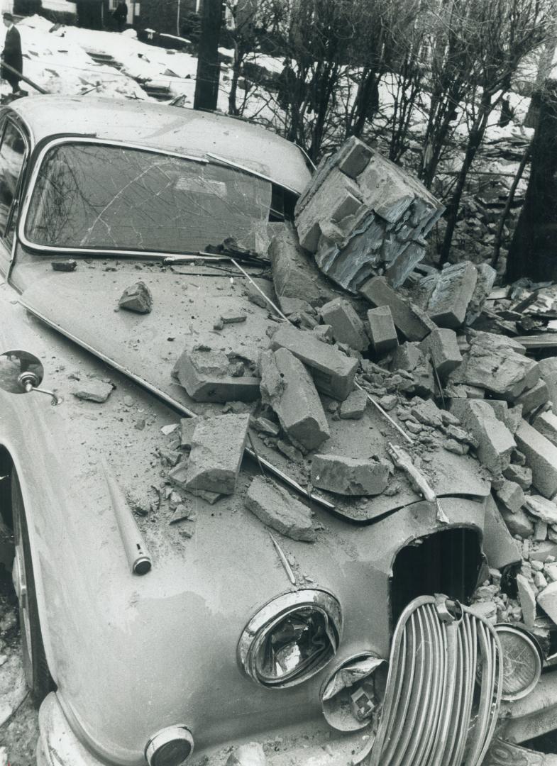 Blast-damaged car of neighbor Ralph Dilworth was hit by wood and stone from the explosion