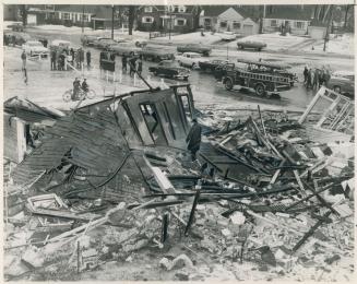 Fireman patrol wreckage of the Bebbington home which was demolished in one bewildering instant Saturday by an explosion, the exact nature of which has(...)