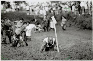 After the off-road vehicles had finished churning through the 58-metre mud bog course at the Oshawa-Whitby fair, fans jumped in and struggled toward t(...)