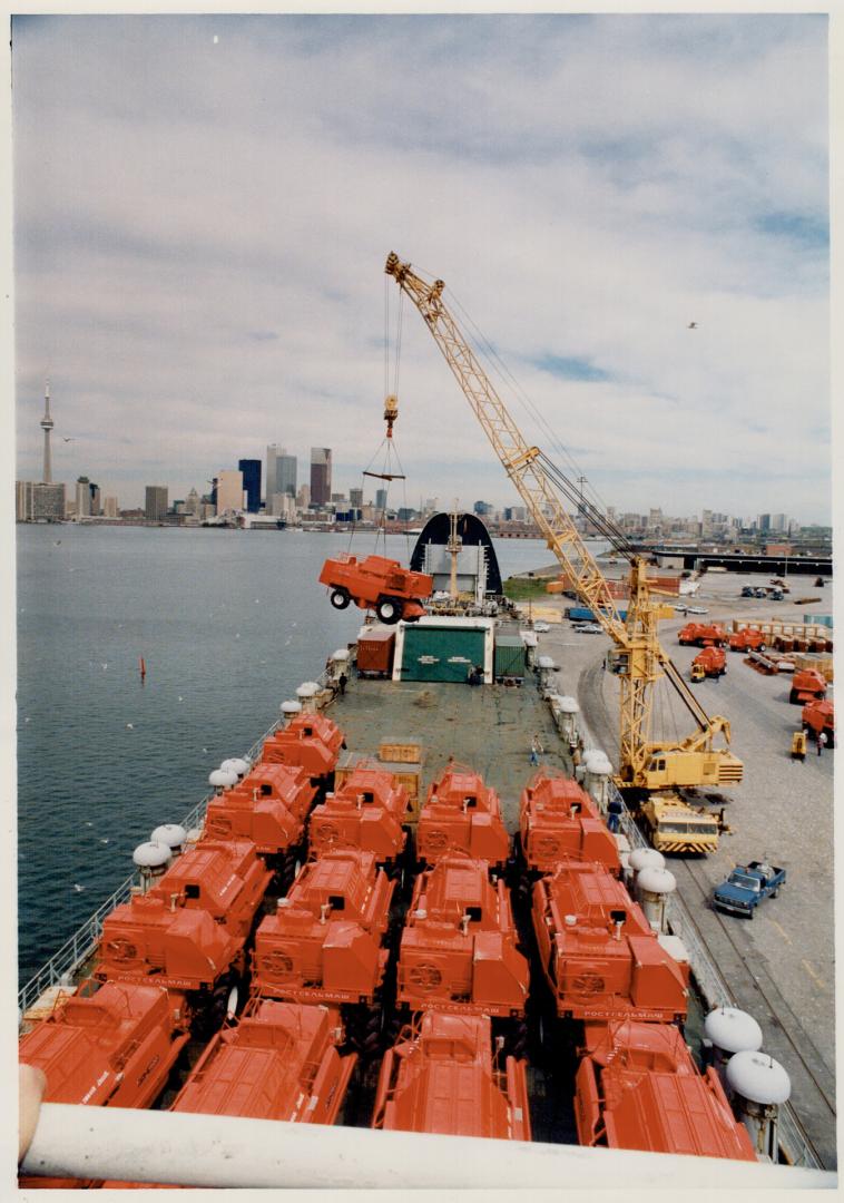 Selling red: The top deck of the Soviet freighter Aleksandr Starostenko is covered with 25 bright red combines costing $ 100,000 each