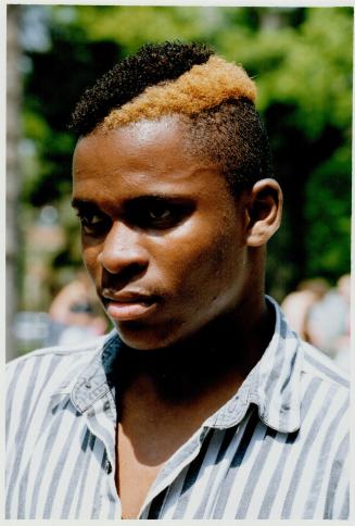 Carltlon James with Roots/B Boy-style shaved, dyed hair
