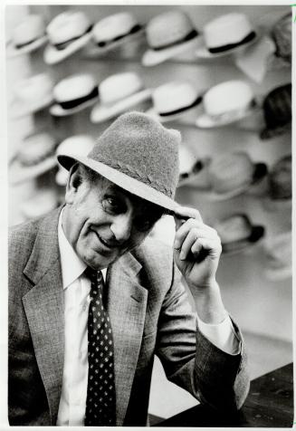 Topping it off: Boutique owner Bobby French, above, models a hat styled like those of Diana, Princesss of Wales