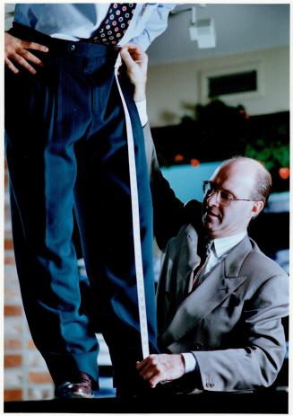 Tailor Ron Burrows measures a man for clothing alterations while, at top, stylist Dolores cuts a client's hair