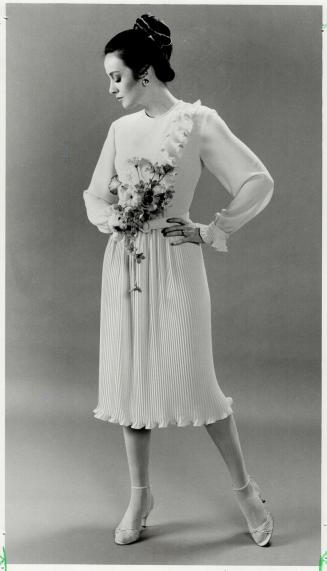 Pleat interest: Hugh Garber's pleated dress, above, $245 at Simpsons, Flowers by Jane, earrings, Holt Renfrew, shoes, Feathers