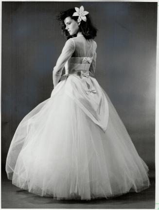 Right, layers of white tulle topped with bias-cut silk apron bought by Henri Bendel for its bridal collection, $1,400
