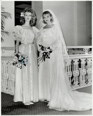 Bride wears ivory heirloom-type organza, attendants wears apricot gown with puffed sleeves