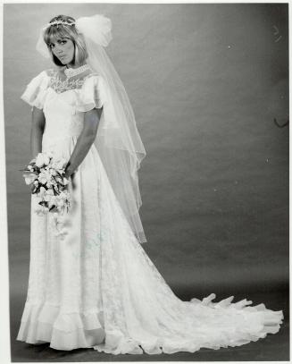Flounced train: Left, capelet style bodice with flounced train, lace skirt, $650, Juliet wreath holds veil, $140, only at The Room, Simpsons