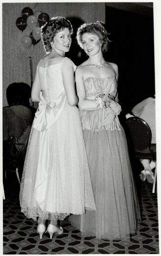 Identical twins Colleen Stanczuk and Maureen Waterworth chose to wear prom dresses from Courage My Love