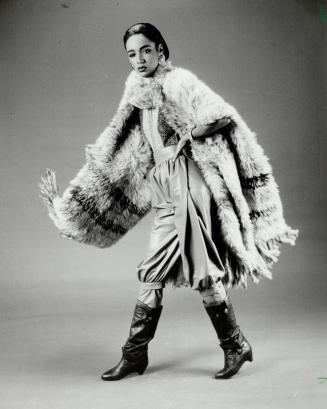 Playing possum: Sheer luxury is a woven possum cape worn over a knitted calfskin skivvy and beige leather pants