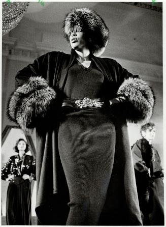 Fur flare: Fur trimmed flared coat, left, worn over body skimming knit dress, shows Wayne Clark's sexy style for fall