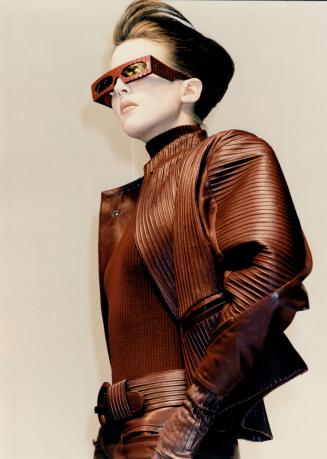 Hell-bent for leather: Left, Claude Montana put his magic touch on leather in a striking group of long jackets and miniskirts in suede, calf and kid