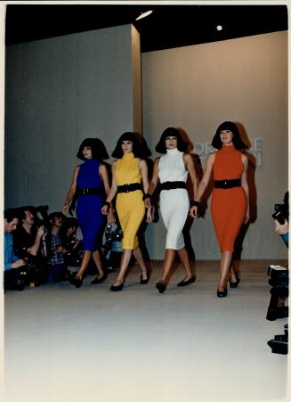 Tube dresses: Adrienne Vittadini's collection for Spring '86 includes bright, high-necked tube dressess, above, with wide-belted waists