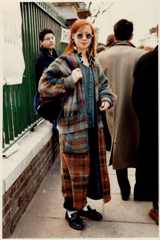 Woven coat with stuffed pockets, wool and brass earrings, fringed loafers, hit a bright if bizarre, note