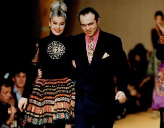 Making a splash: Left, Christian Lacroix and his favorite model, Marie Seznec, in sun-pleat skirt and cashmere turtleneck with ornate necklace