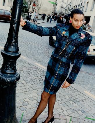 Above, Patrick Kelly's shapely lip motif wool jersey dress worn with gloves with painted nails