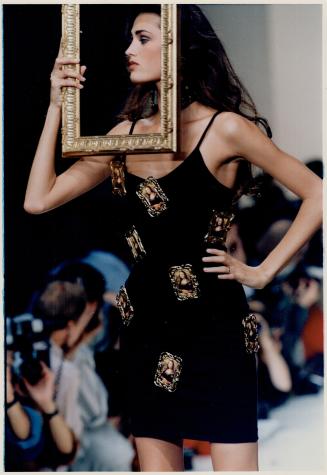 Gimmicky glamour: Above, Patrick Kelly's black mini with framed portraits of the Mona Lisa, left, Kelly and American entertainer Grace Jones at his show for spring / summer '89