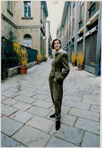 Right, moss green check jacket and plaid trousers, photographed on the Via della Spiga, Milan