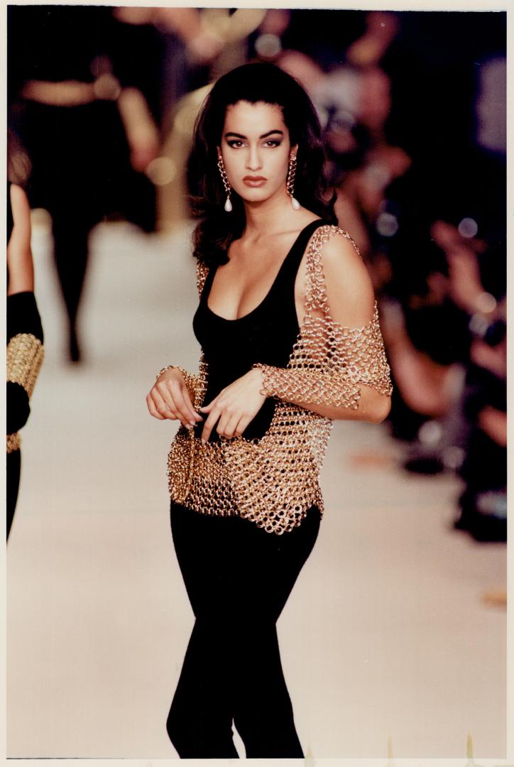 Left, body suit with gold mesh wrap was designed by Karl Lagerfeld for chanel